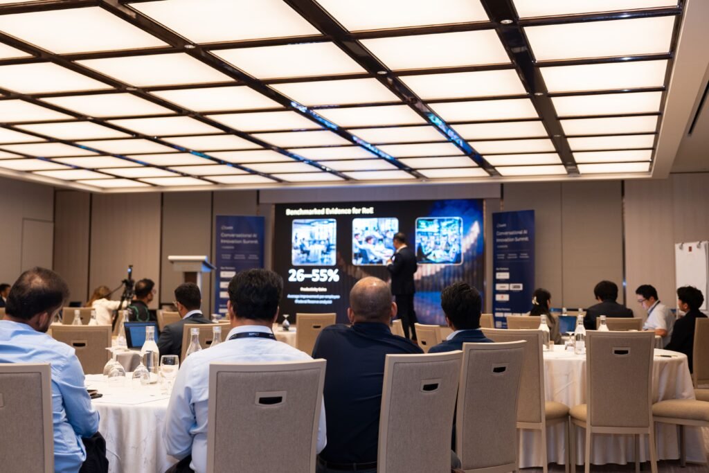 The audience in a large hall during a keynote